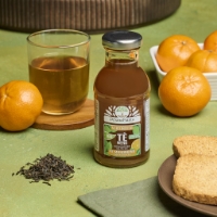 Tè Freddo - Tè Nero Bio Al Mandarino, frontale sfondo mandarini